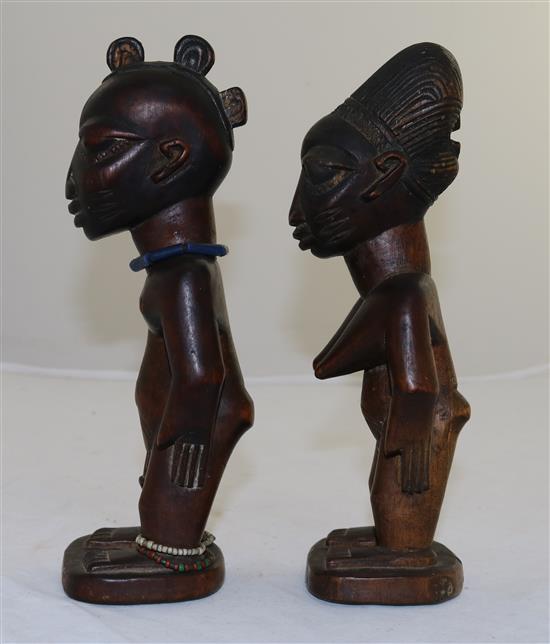 Two Yoruba wood figures of a man and a woman, late 19th/early 20th century, 9in.